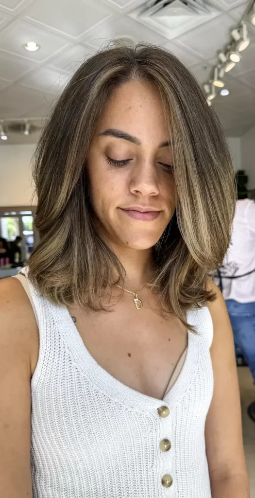 Client with a short, softly layered brunette haircut