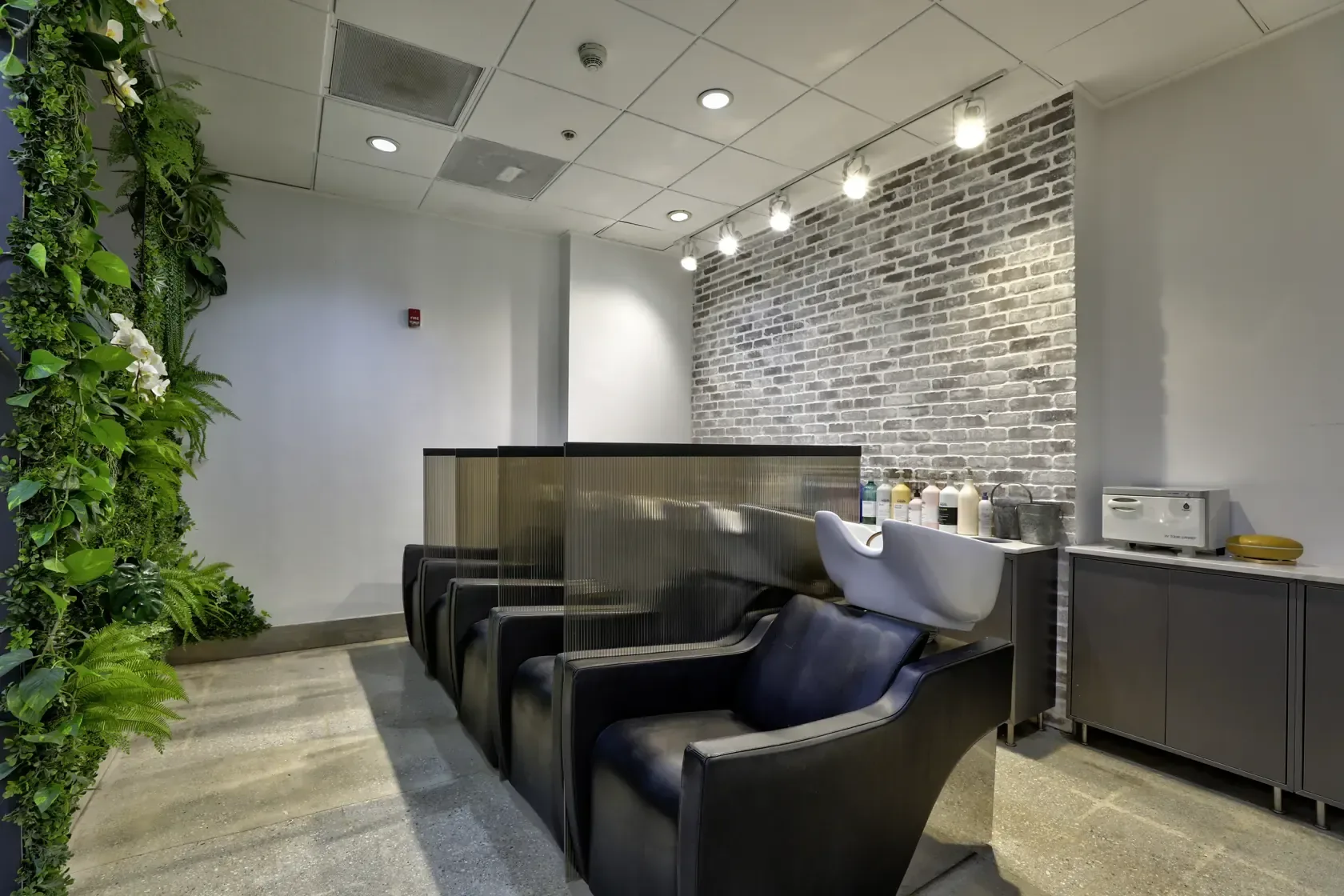 Shampoo basins and hair-treatment chairs at Gleam Hair Studio