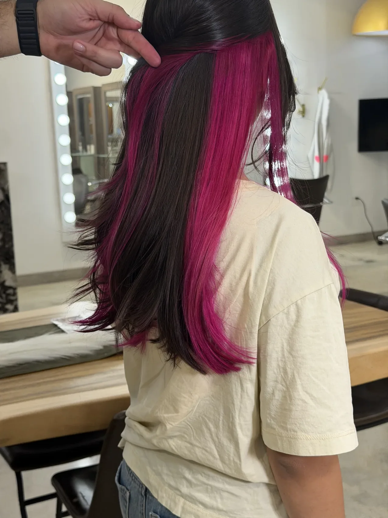 Bright magenta and deep brunette hair color on a Gleam Hair Studio client